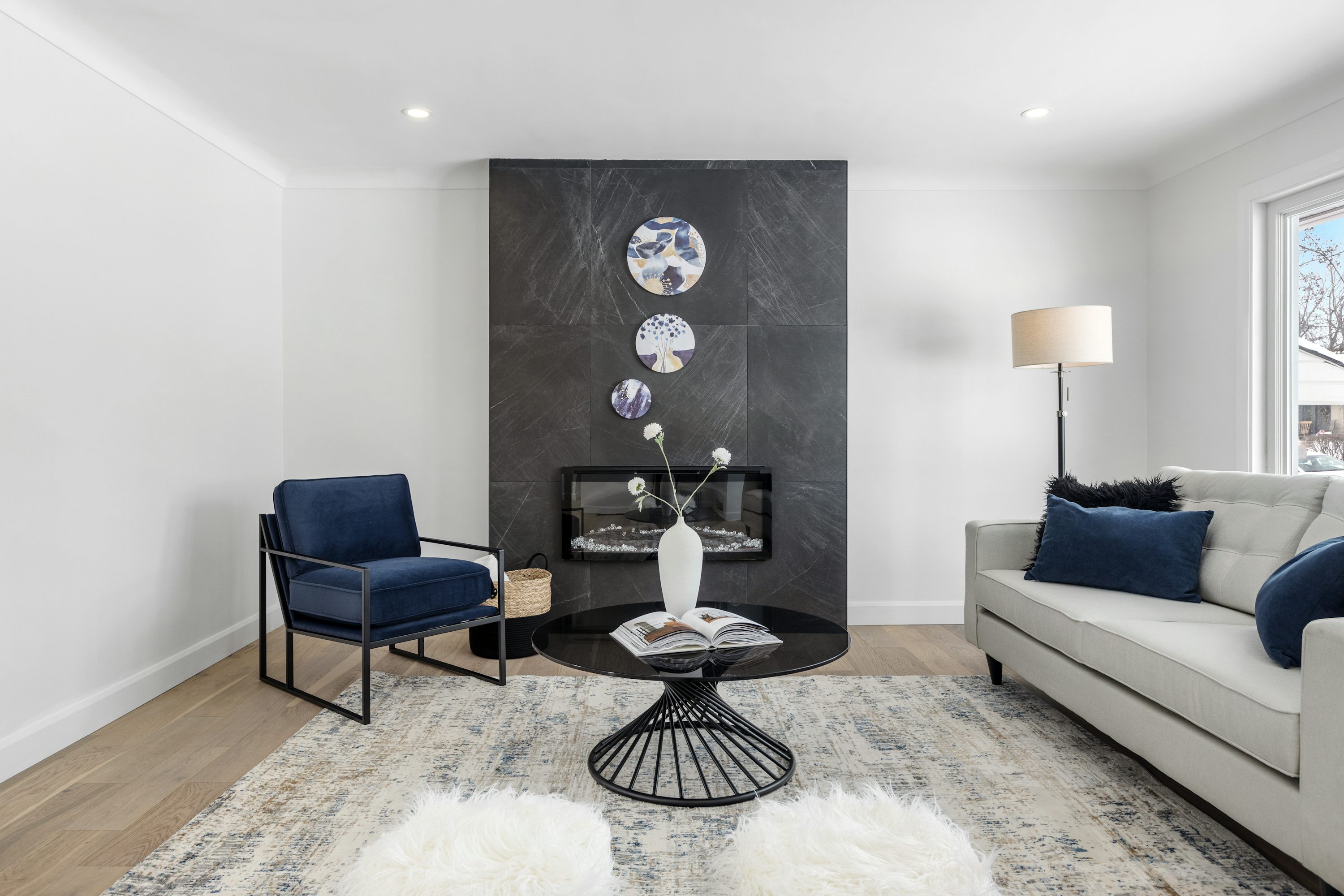 Furnished living room, sofa, fireplace, side table